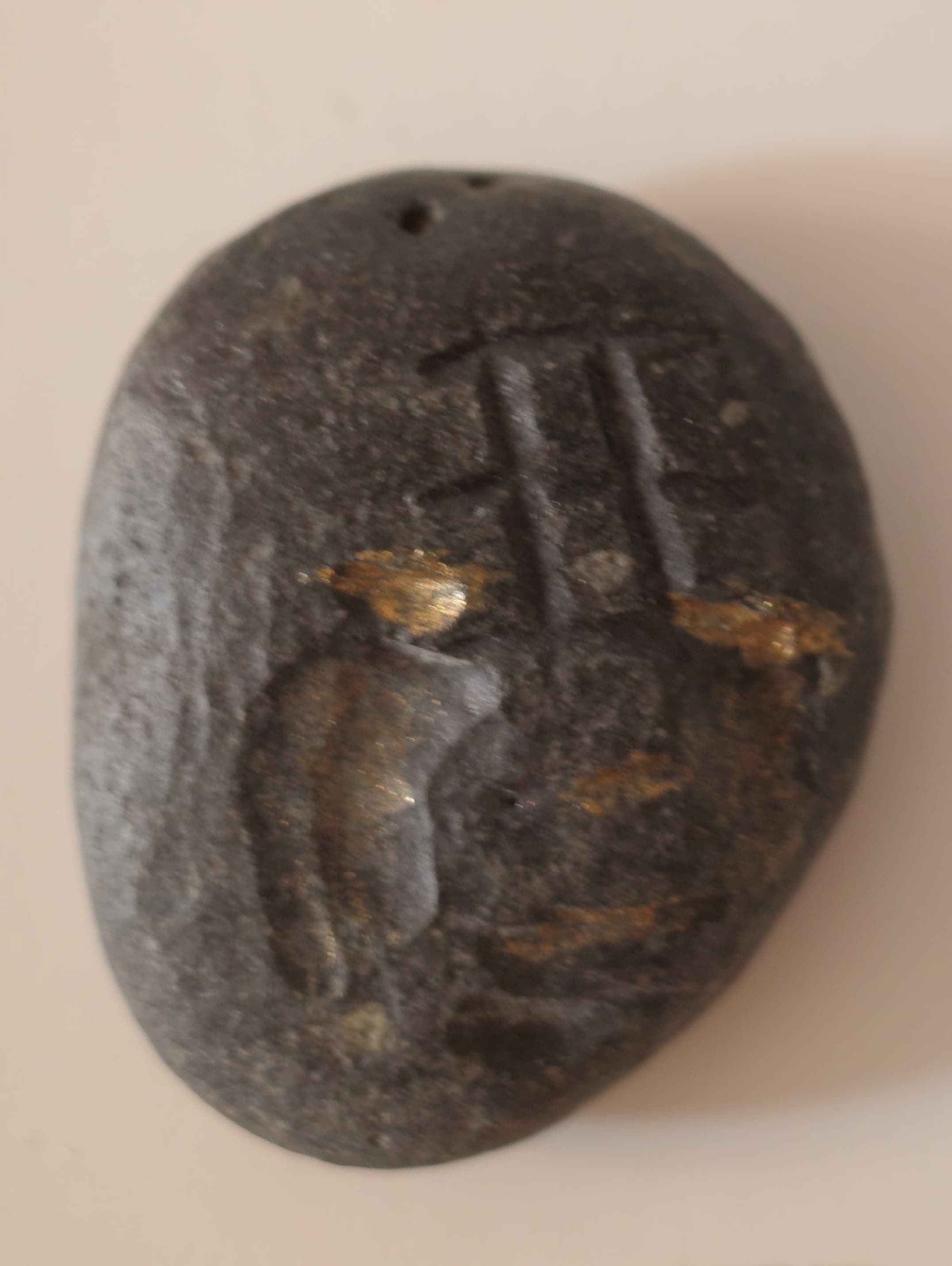 Moneda labrada en piedra, segunda cara
